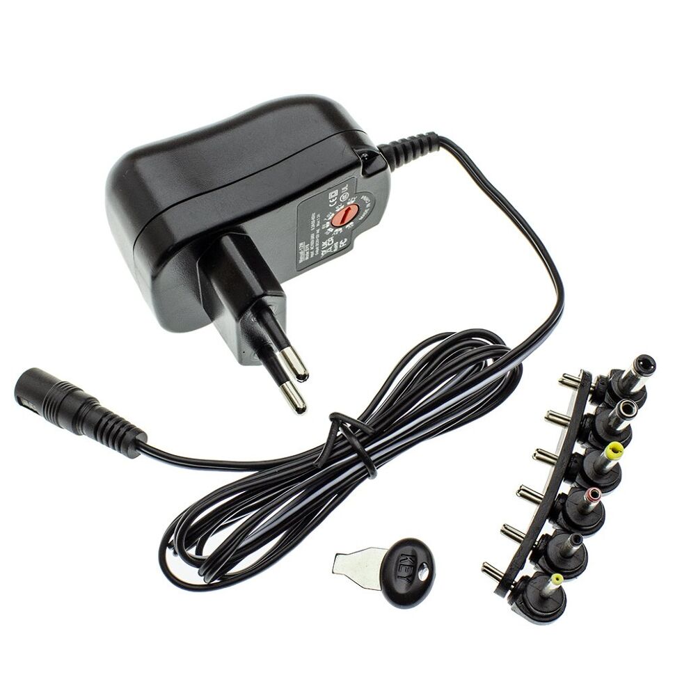 Мережевий зарядний пристрій універсальний з перемикачем SY6 12W 1,2A 7 режимів с 6 перехідниками Мережевий зарядний пристрій універсальний з перемикачем SY6 12W 1,2A 7 режимів с 6 перехідниками